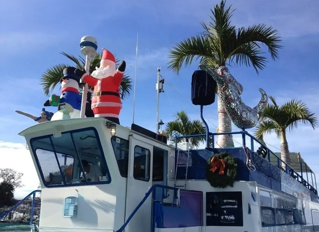 Santa decoration on a boat with palm trees in sarasota