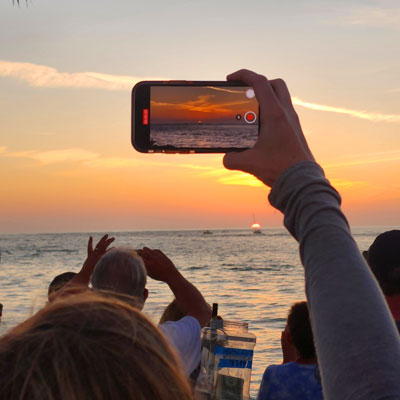 taking picture of sunset on boat