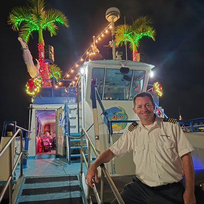 Boat captain on decorated boat