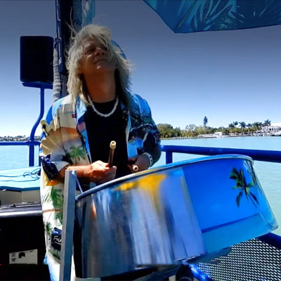 Musician playing on boat in sarasota bay